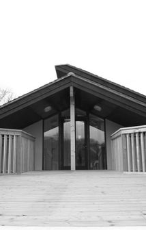 Front glazed entrance exposed timber frame in black and white