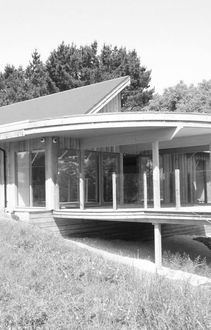 View of cantilevered terrace at Bishop Cornish Education Centre in black and white 